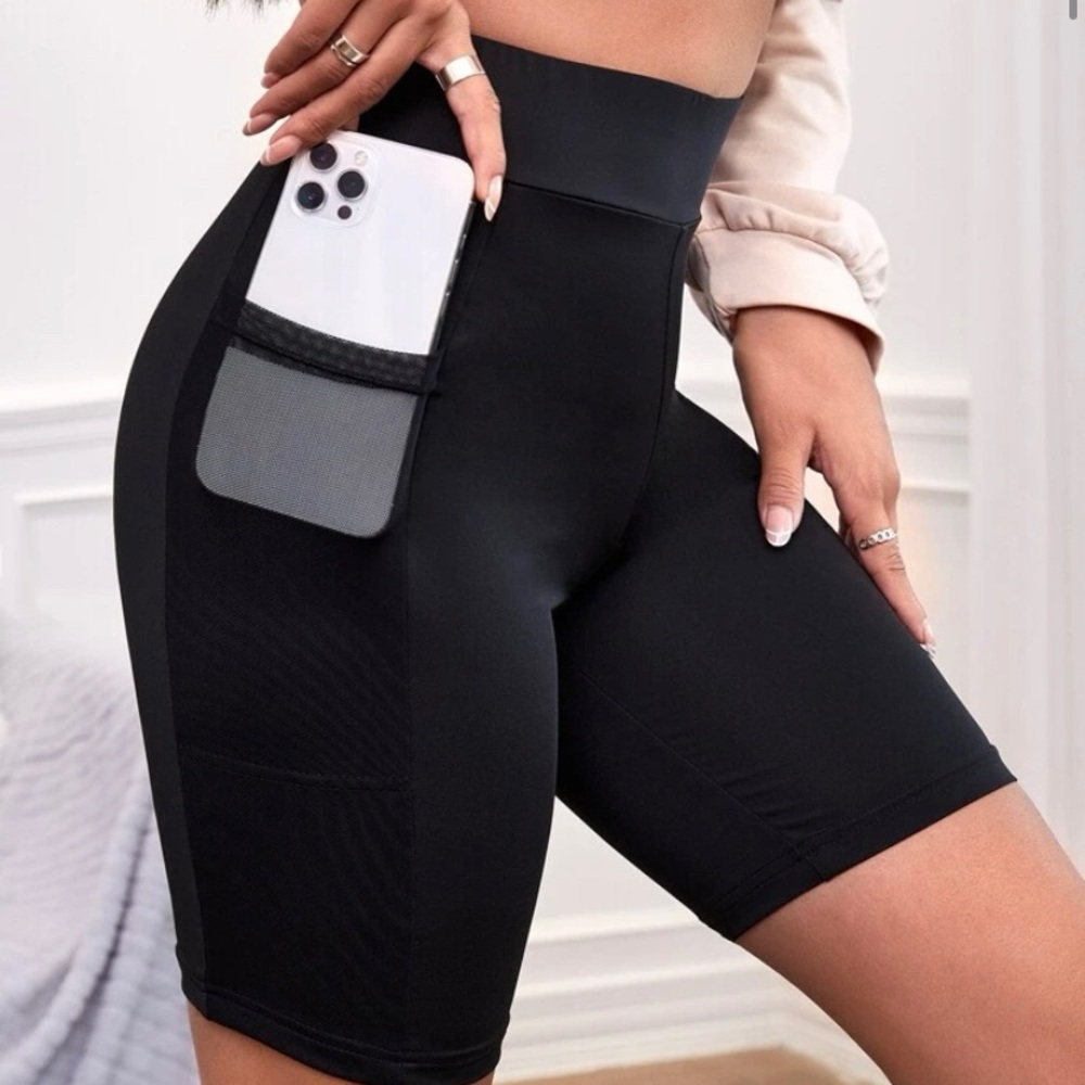 Black SHEIN biker shorts with mesh pockets. Never worn